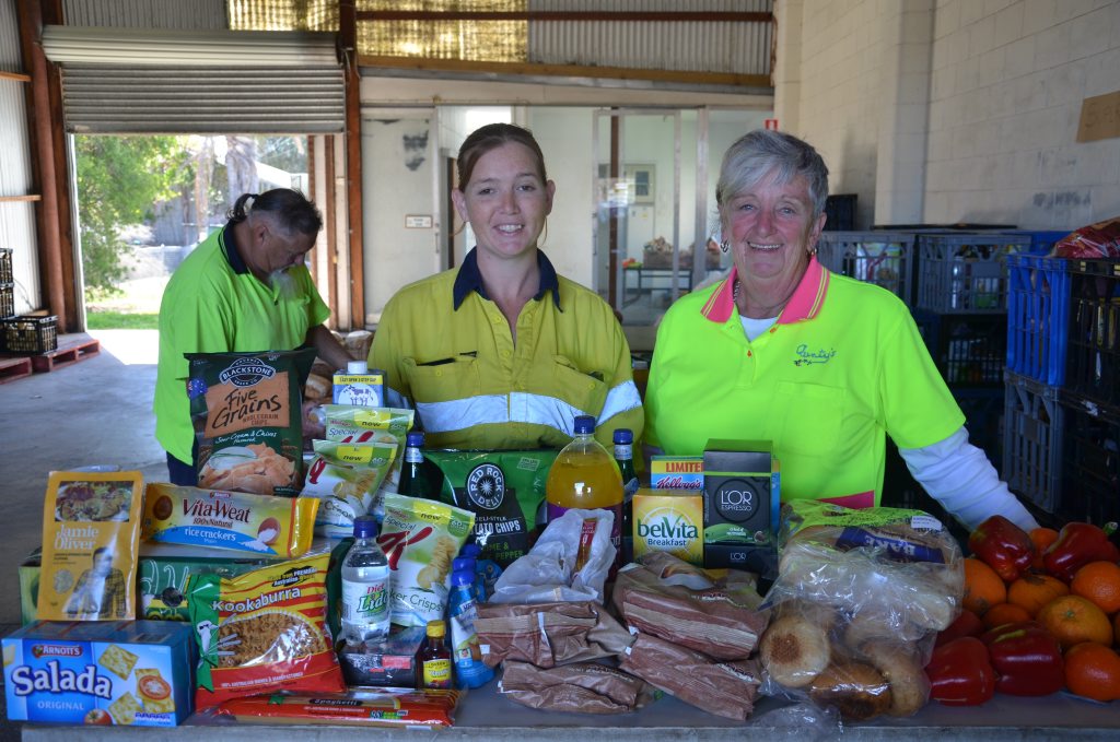 Greg Watts, Esther Spicer and Marlene Beattie from Food Assist with an example of their Super Hamper. 